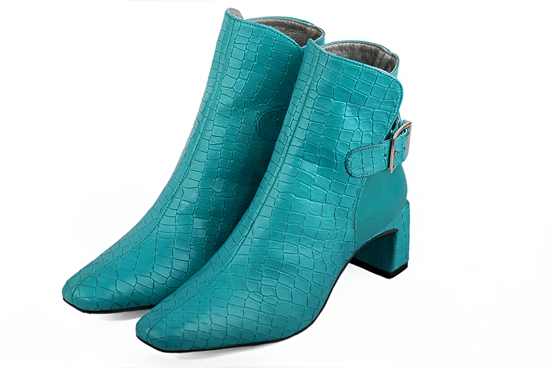 Turquoise blue women's ankle boots with buckles at the back. Square toe. Medium flare heels. Front view - Florence KOOIJMAN